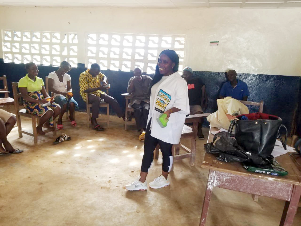 Constance Teage training a community in Liberia on how to use a Talking Book.